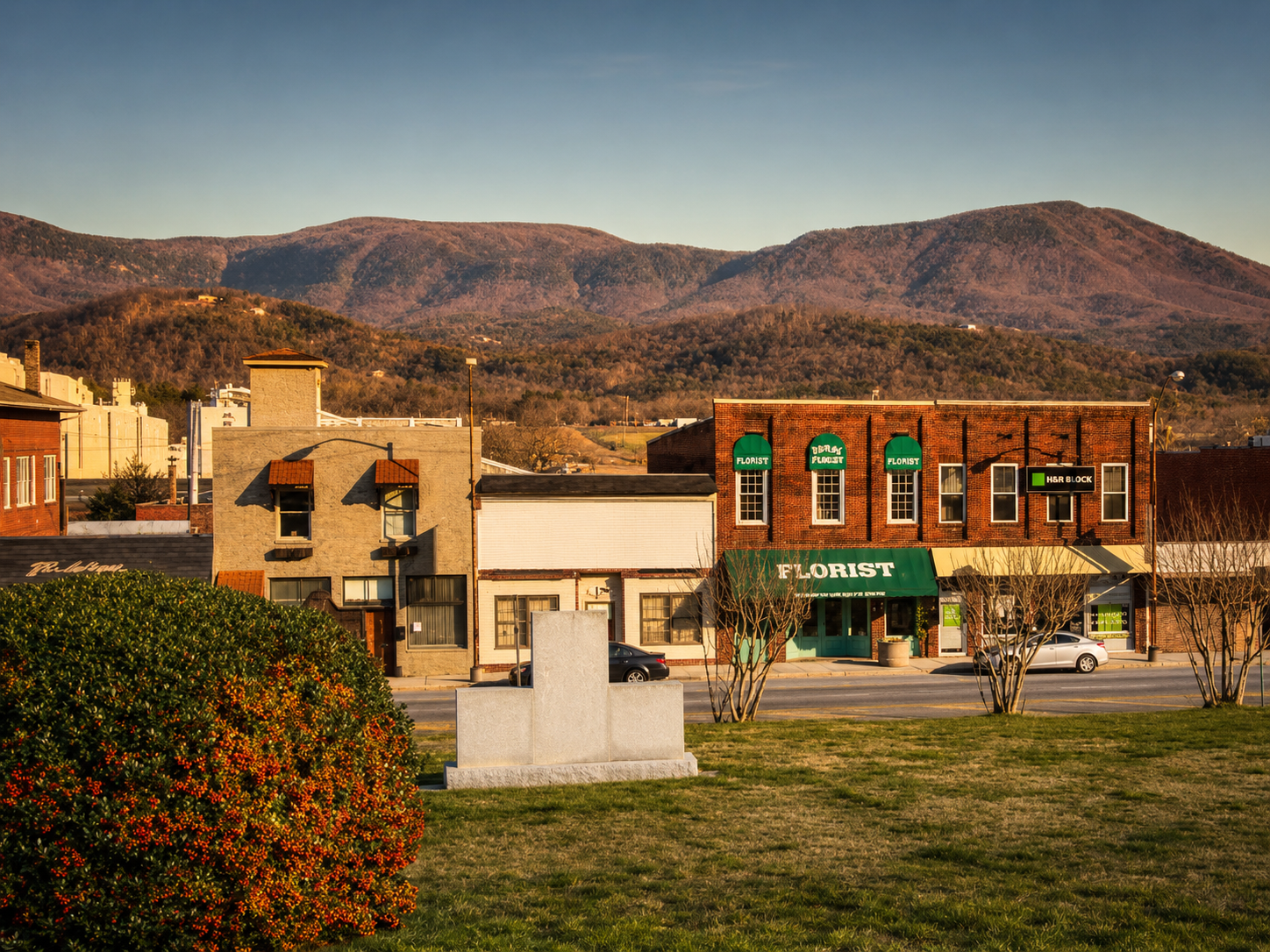 Downtown Chatsworth, Georgia storefronts with the Cohutta mountains in the background at golden hour