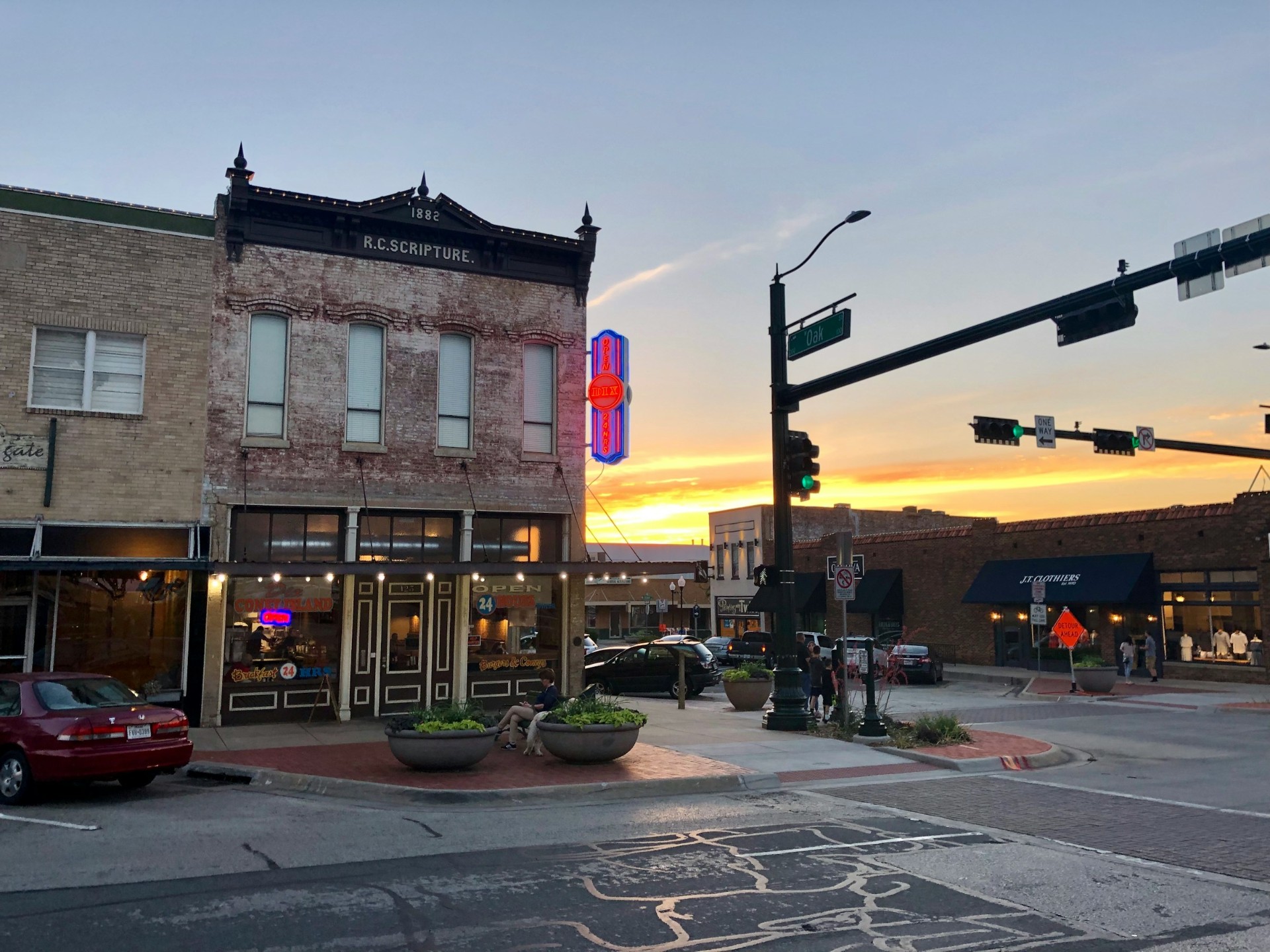 Historic 1882 R.C. Scripture brick building on a small-town main street at sunset
